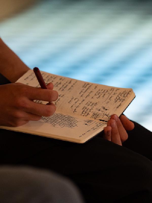 Audience member taking notes at Digital Cultures 2024