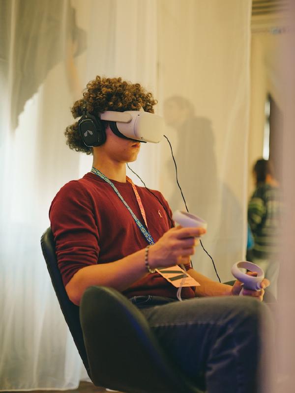 Another participant experiencing VR at Spektrum