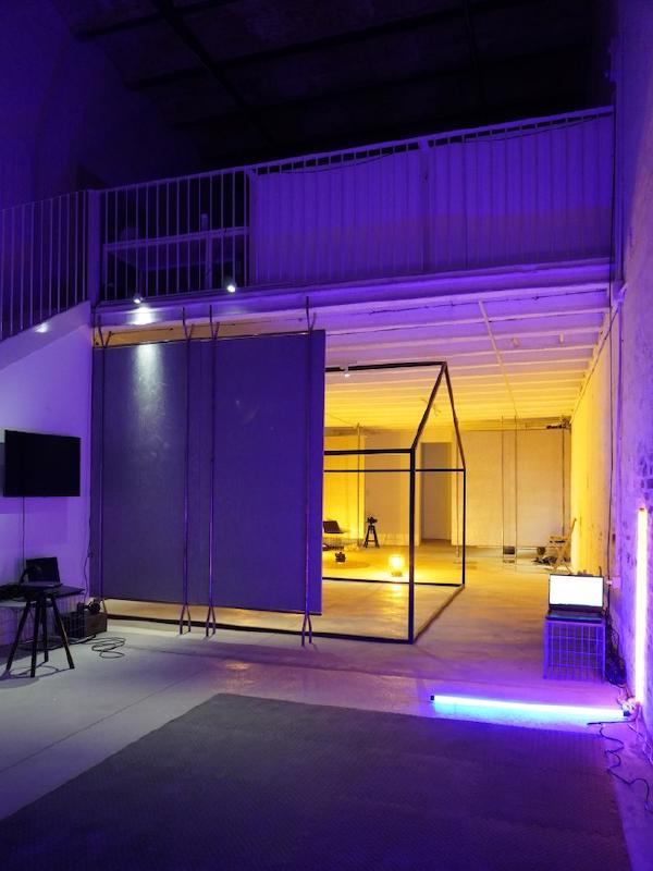 Violet lighting in a section of the exhibition